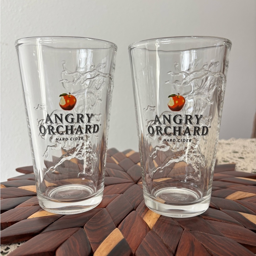NWOT 2 Angry Orchard hard cider embossed pint Glasses. Etched apple in bottom!